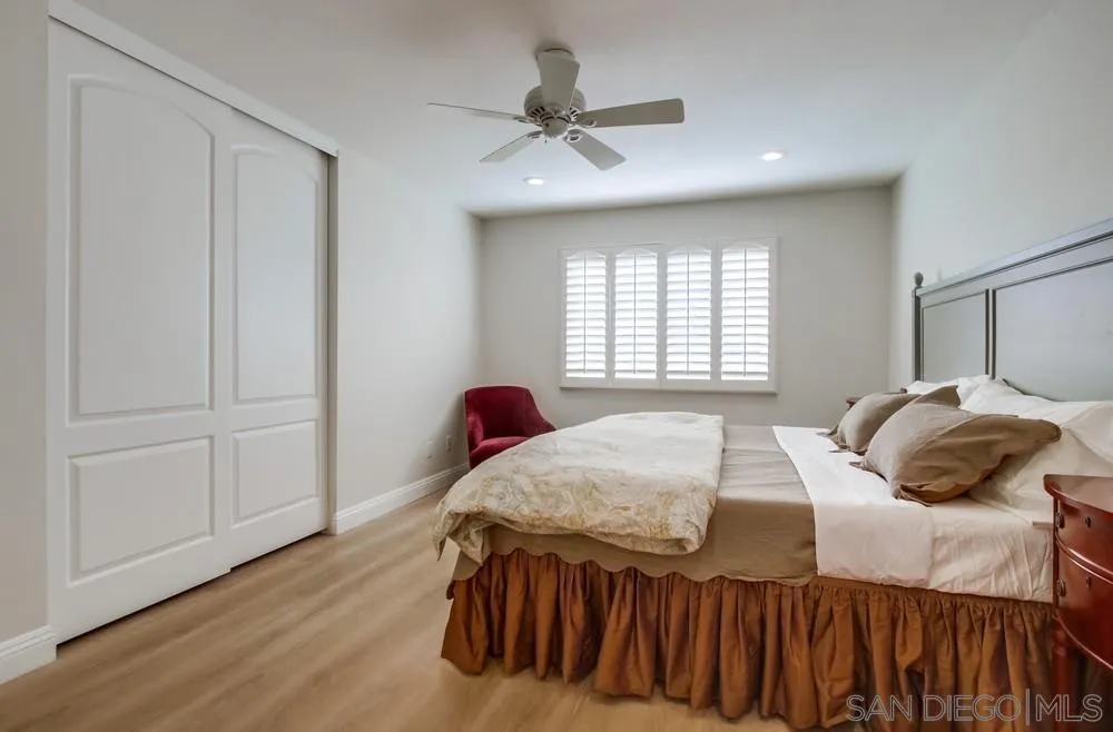 16632 Roca Drive San Diego, CA 92128 - Photo 20 of 44 a bedroom with a bed and a window