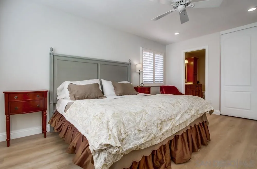 16632 Roca Drive San Diego, CA 92128 - Photo 22 of 44 a bedroom with a bed and a dresser