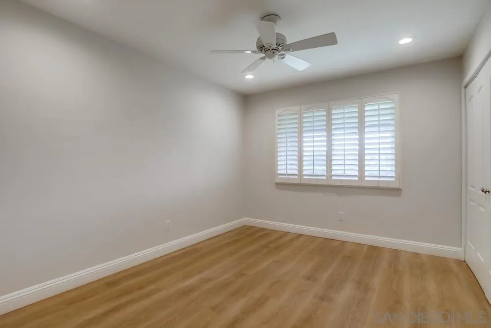 16632 Roca Drive San Diego, CA 92128 - Photo 26 of 44 an empty room with a window and a fan