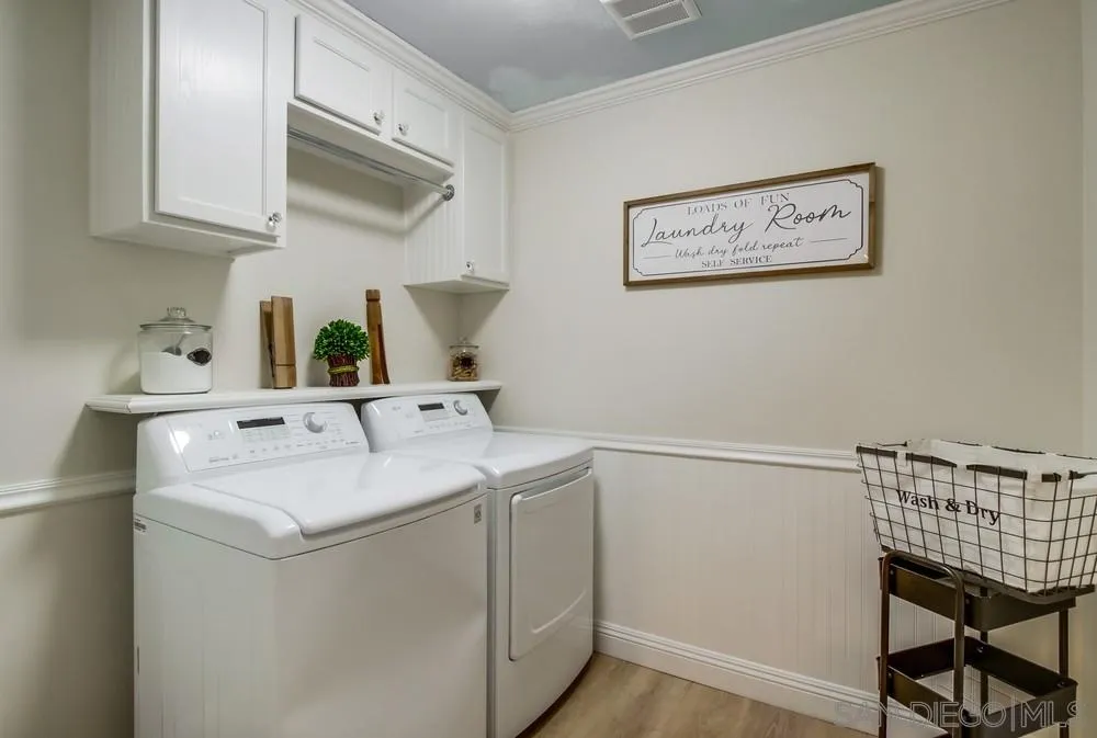 16632 Roca Drive San Diego, CA 92128 - Photo 31 of 44 a utility room with dryer and washer