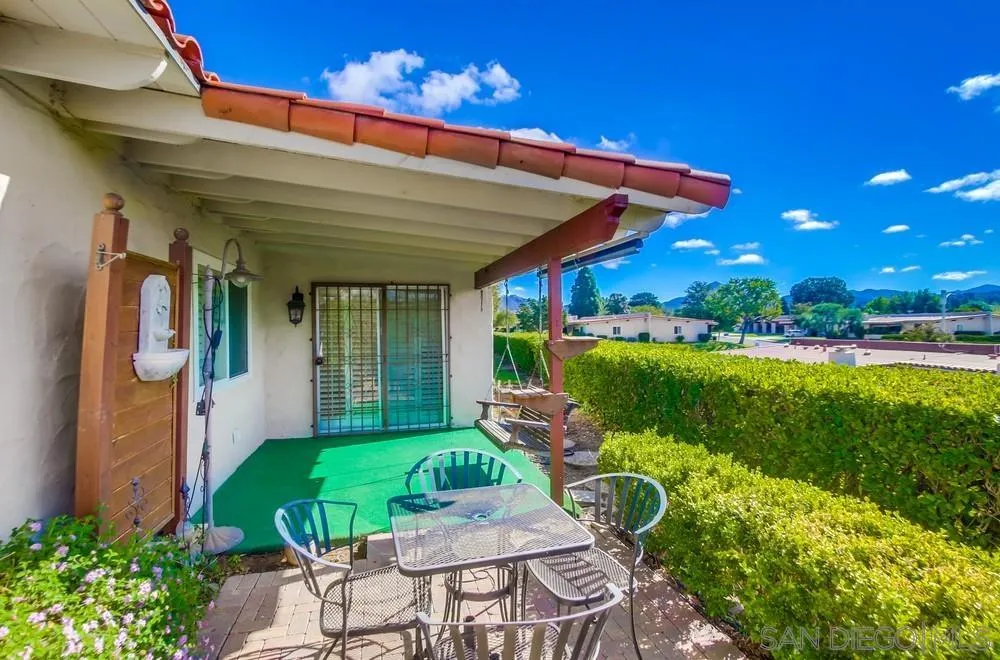 16632 Roca Drive San Diego, CA 92128 - Photo 33 of 44 a patio with table and chairs and potted plants