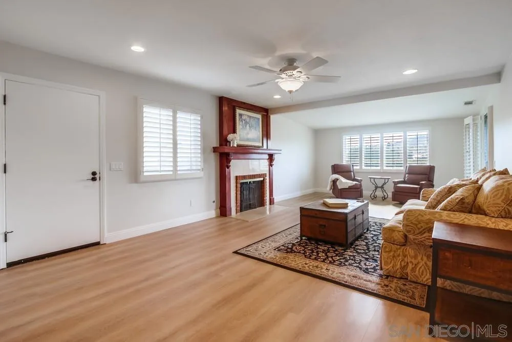 16632 Roca Drive San Diego, CA 92128 - Photo 7 of 44 a living room with furniture and a fireplace