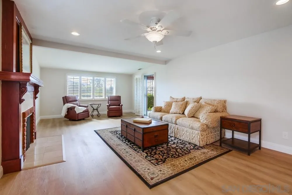 16632 Roca Drive San Diego, CA 92128 - Photo 8 of 44 a living room with furniture and a fireplace