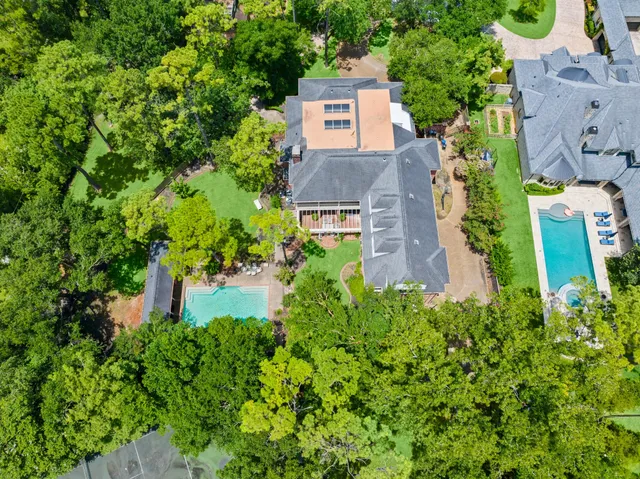 an aerial view of a house with a garden