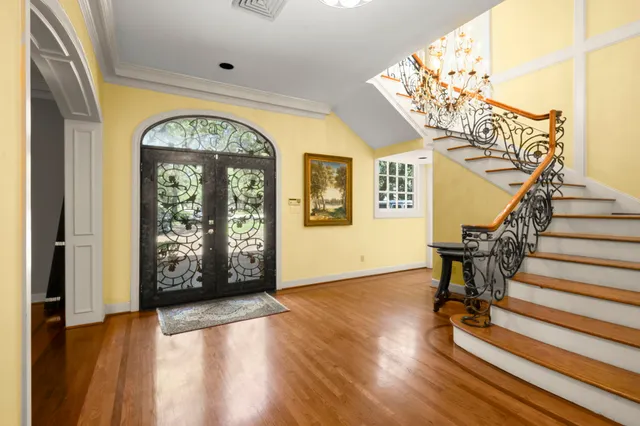 a view of entryway with wooden floor