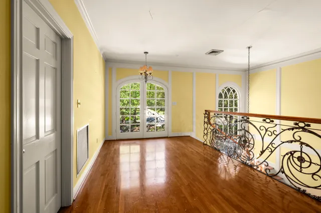 a view of an entryway with wooden floor