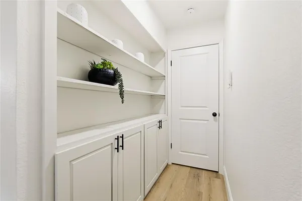a view of entryway with wooden floor