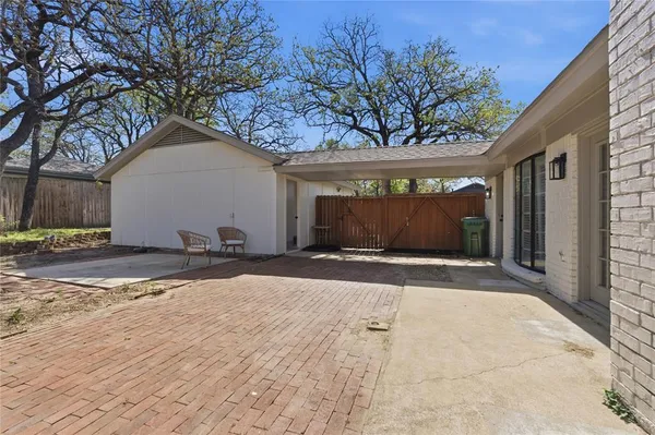a view of garage with a yard