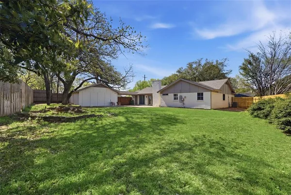 a view of a house with a big yard