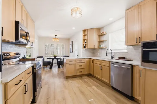a large kitchen with cabinets