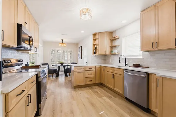 a large kitchen with cabinets