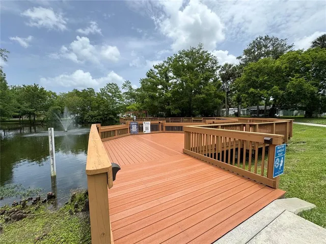 a view of a swimming pool with a lake view