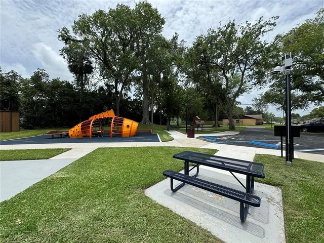 a view of a backyard with sitting area