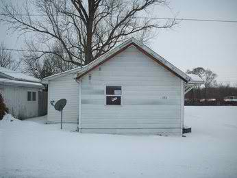 1130 Harrison Street Walkerton, IN 46574 - Photo 1 of 1 a backyard of a house with yard and garage