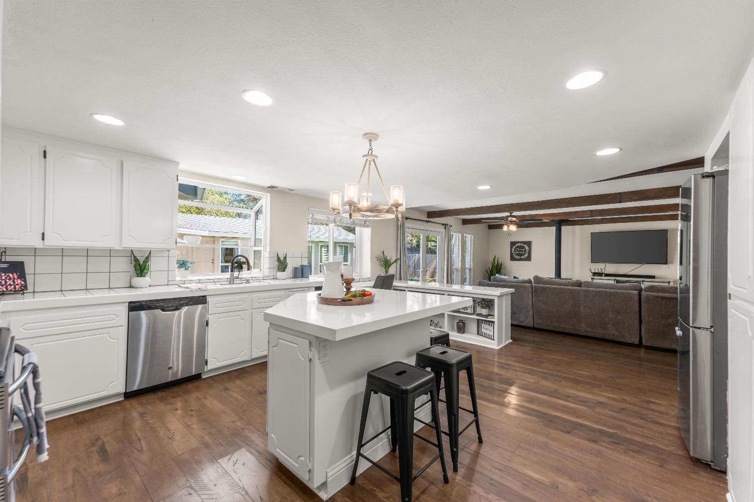 a kitchen with counter top space cabinets and stainless steel appliances