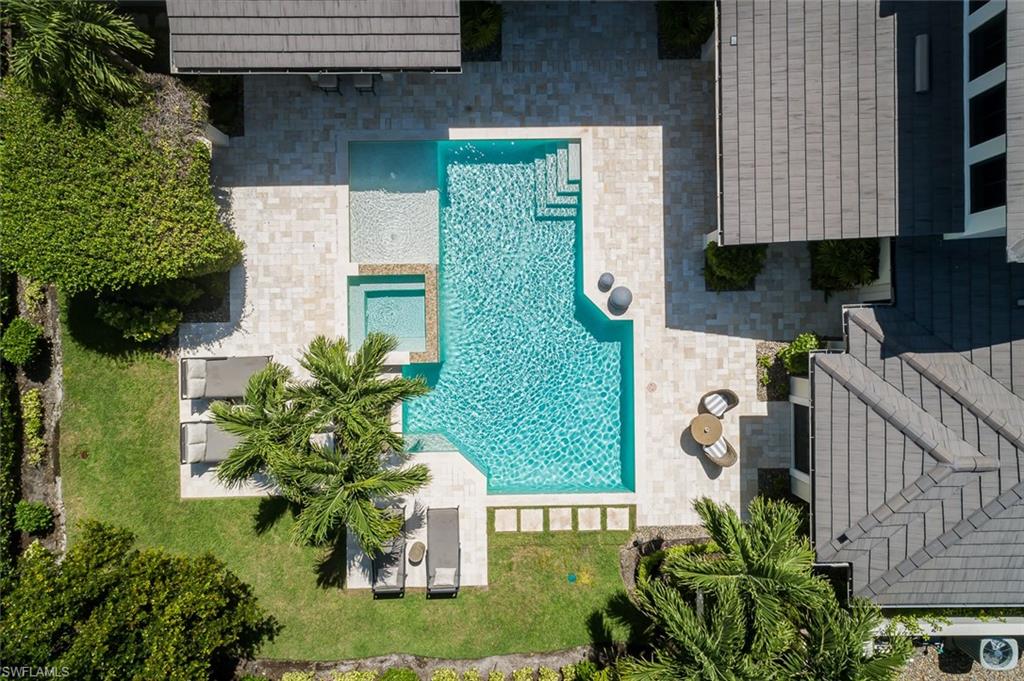 3170 Crayton Road Naples, FL 34103 - Photo 18 of 50 a aerial view of a house with garden space and street view
