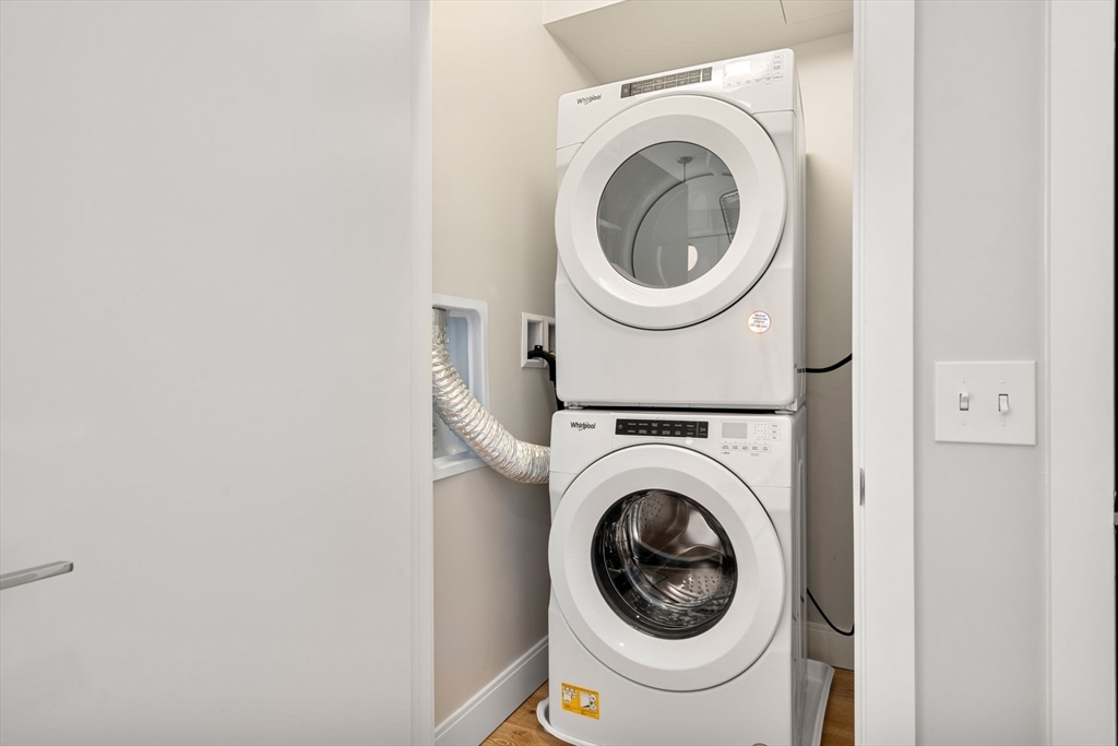 191 Washington Street, Unit 710 Boston, MA 02135 - Photo 18 of 35 a utility room with dryer and washer
