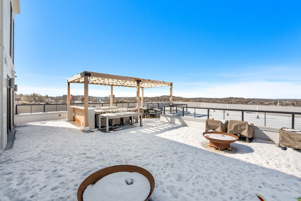 191 Washington Street, Unit 710 Boston, MA 02135 - Photo 20 of 35 a view of a swimming pool with a lounge chair