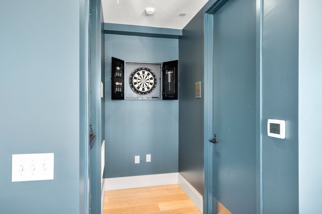 191 Washington Street, Unit 710 Boston, MA 02135 - Photo 23 of 35 a bath room with a shower and a table