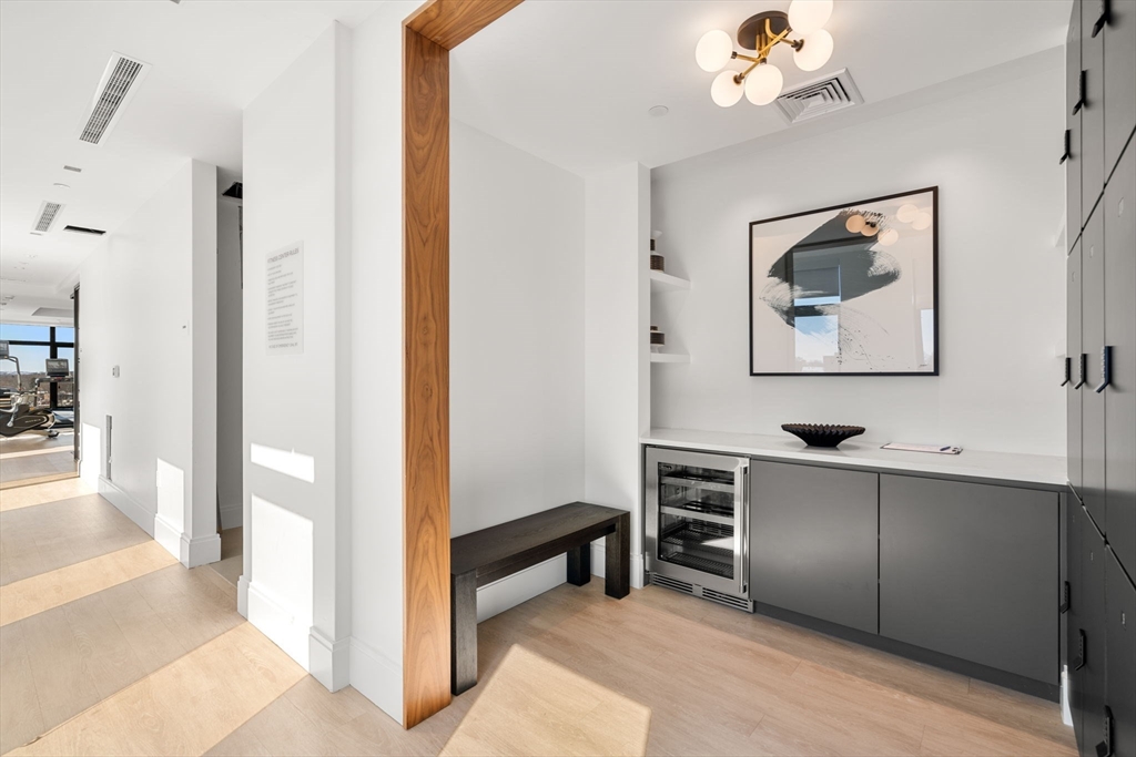 191 Washington Street, Unit 710 Boston, MA 02135 - Photo 28 of 35 a view of a hallway with workspace and a window