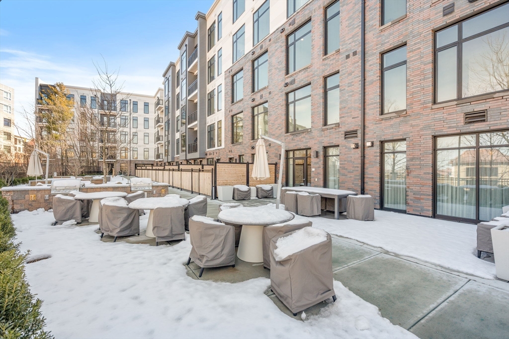 191 Washington Street, Unit 710 Boston, MA 02135 - Photo 29 of 35 a view of a building with outdoor seating