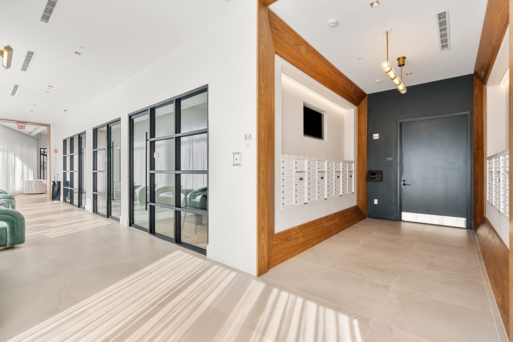 191 Washington Street, Unit 710 Boston, MA 02135 - Photo 33 of 35 a view of a hallway with closet