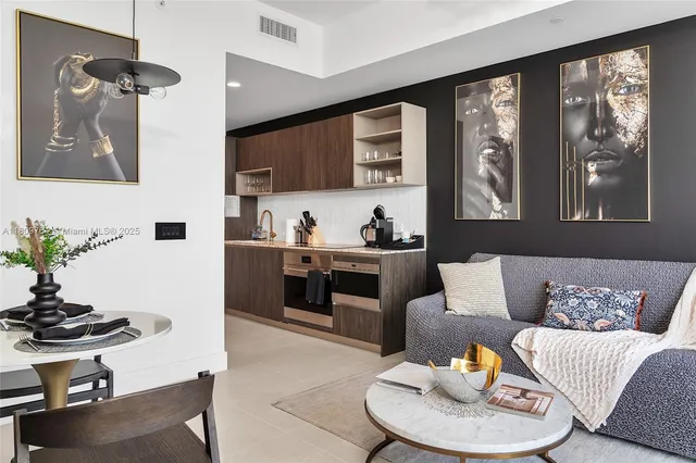 a kitchen with stainless steel appliances granite countertop a stove and cabinets