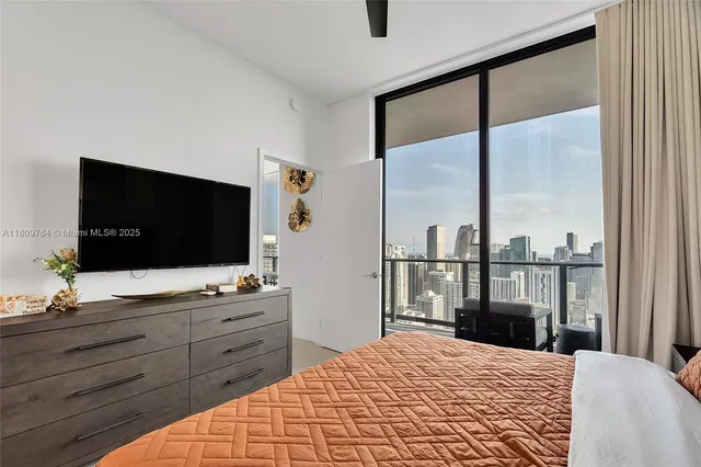 a bathroom with a toilet a sink and a mirror