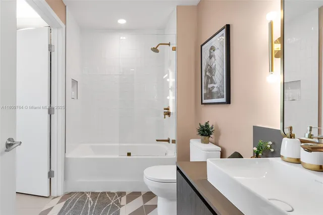 a room with lots of white furniture and window