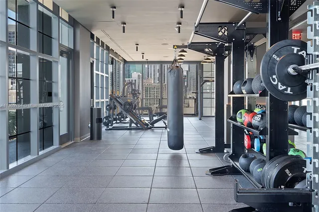 a view of a a dining room with furniture window and wooden floor