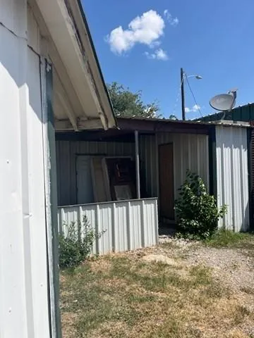 a view of a room with wooden walls