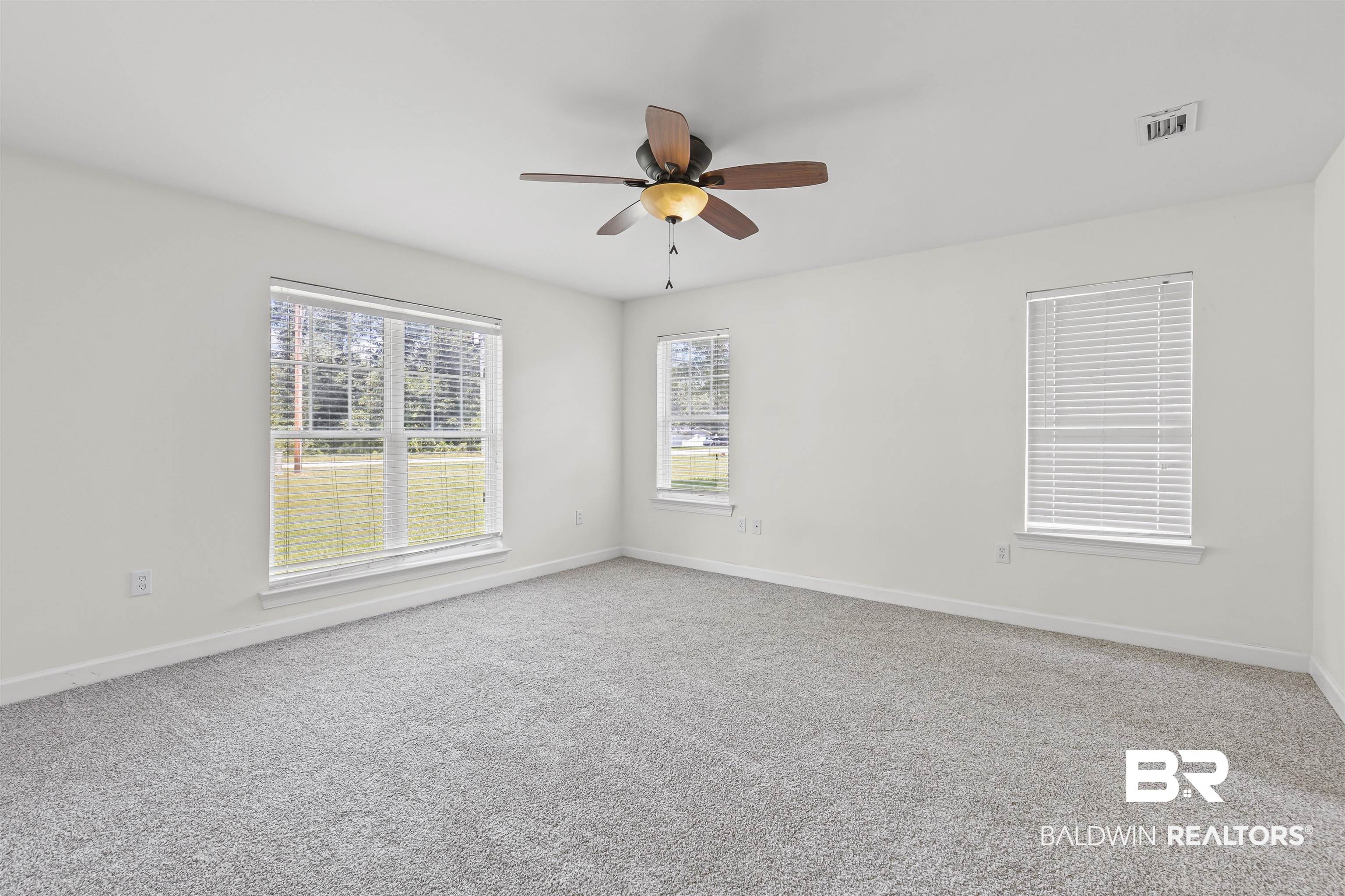 924 Brady Road North Bay Minette, AL 36507 - Photo 21 of 26 Carpeted empty room with baseboards and ceiling fan
