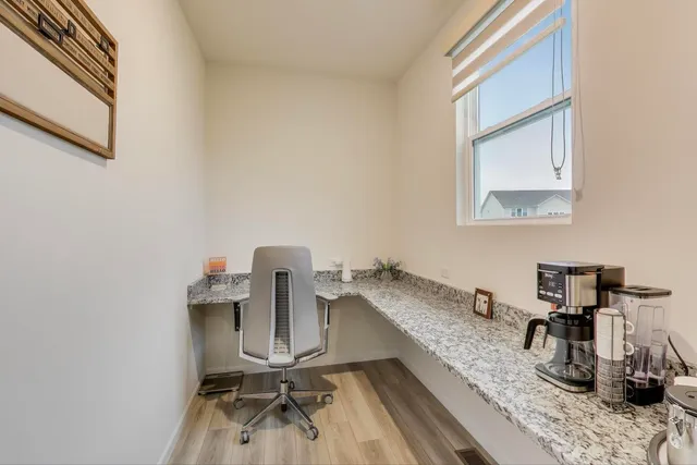 a view of a workspace with furniture