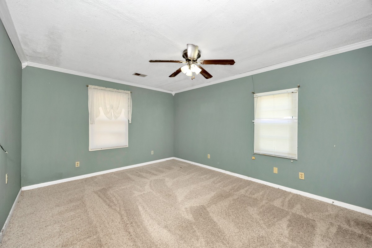 1121 Rolin Hollow Road Ardmore, TN 38449 - Photo 17 of 46 a view of a room with windows and ceiling fan