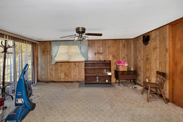 a bedroom with furniture and a window