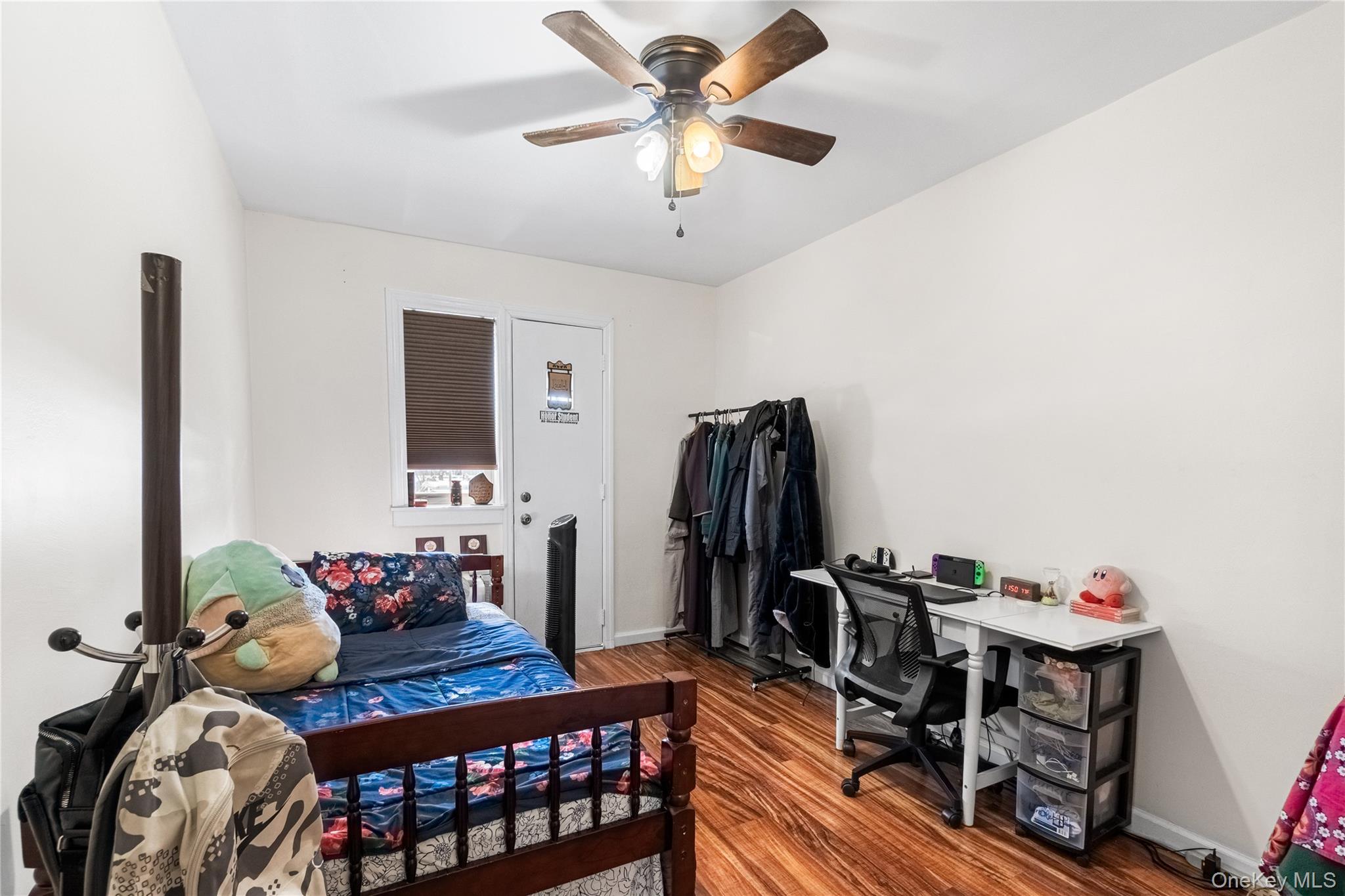203-10 Murdock Avenue Queens, NY 11412 - Photo 16 of 18 Bedroom with dark wood finished floors and a ceiling fan