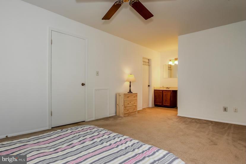 11573 Sullnick Way Gaithersburg, MD 20878 - Photo 15 of 23 Dressing area with vanity and large walk-in closet