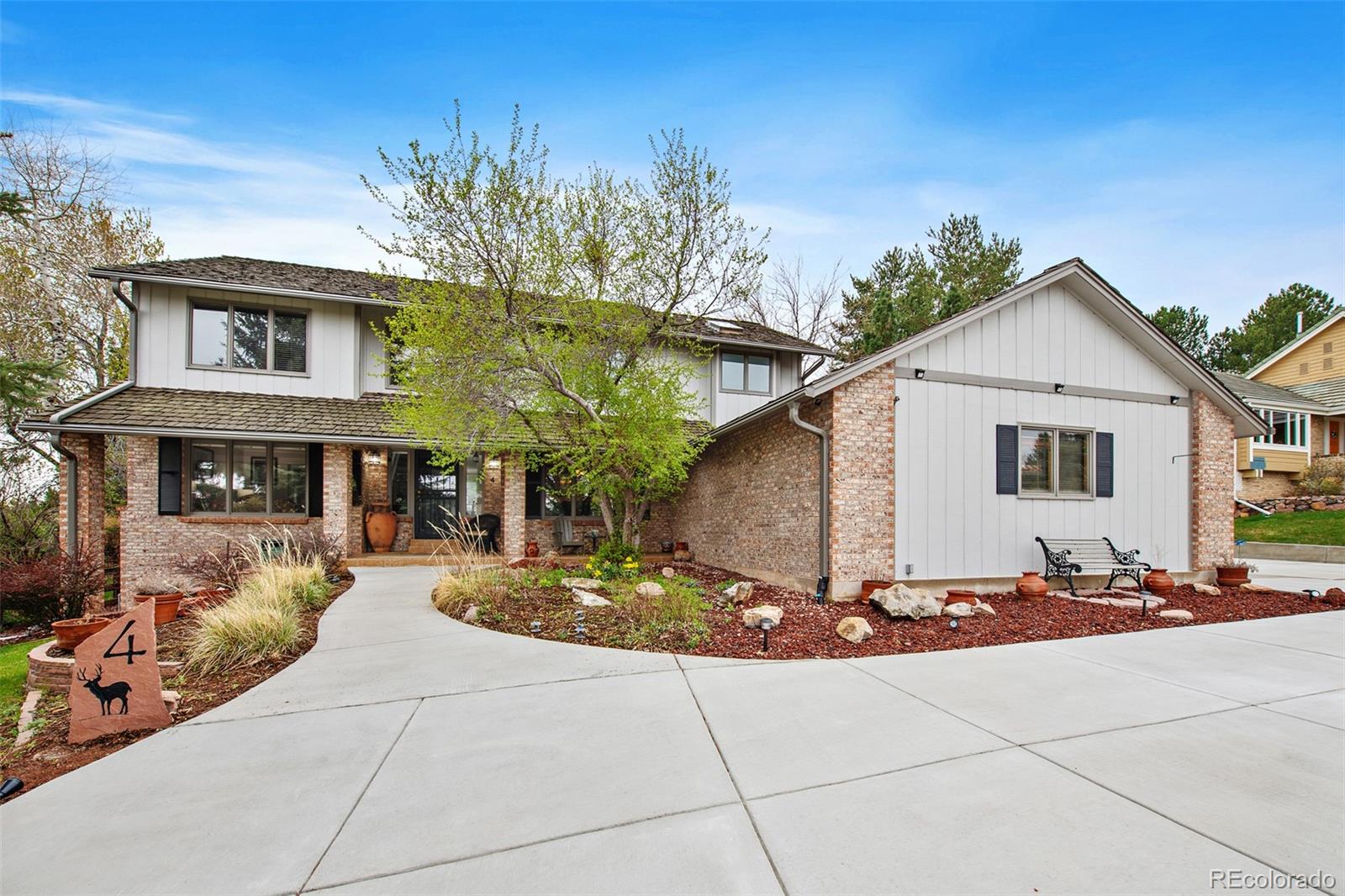 a front view of a house with trees