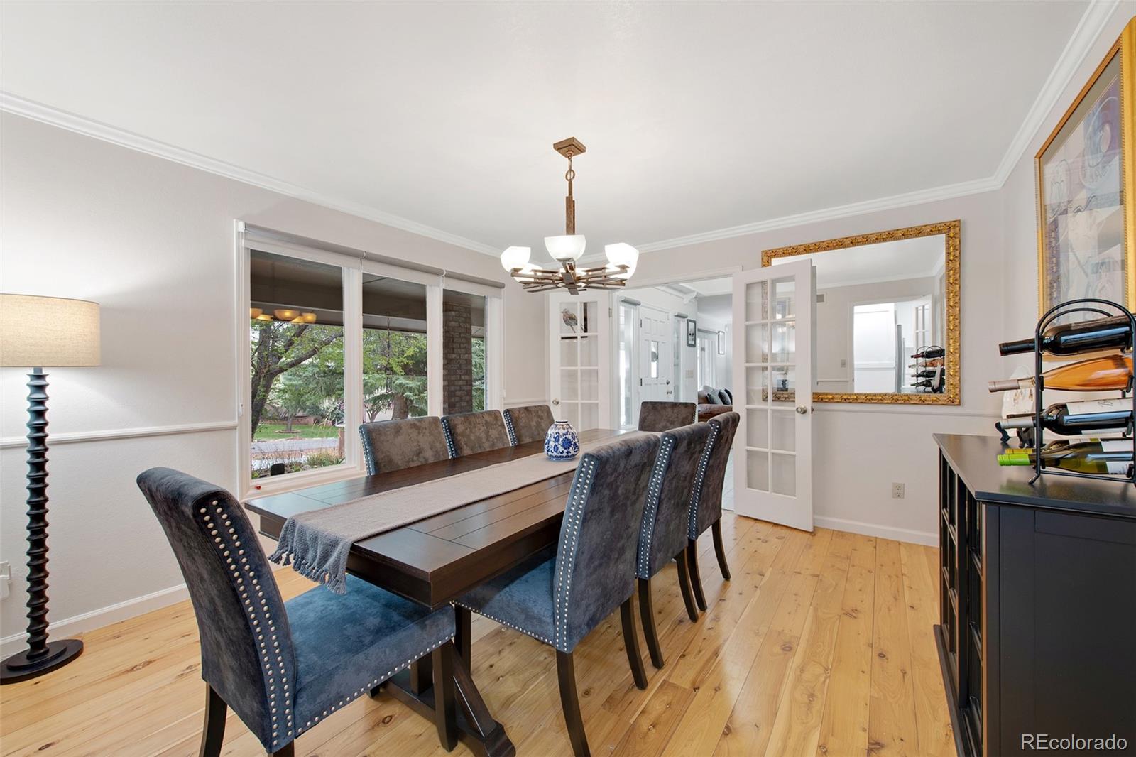 4 Mule Deer Trail Littleton, CO 80127 - Photo 16 of 40 a view of a dining room with furniture window and outside view