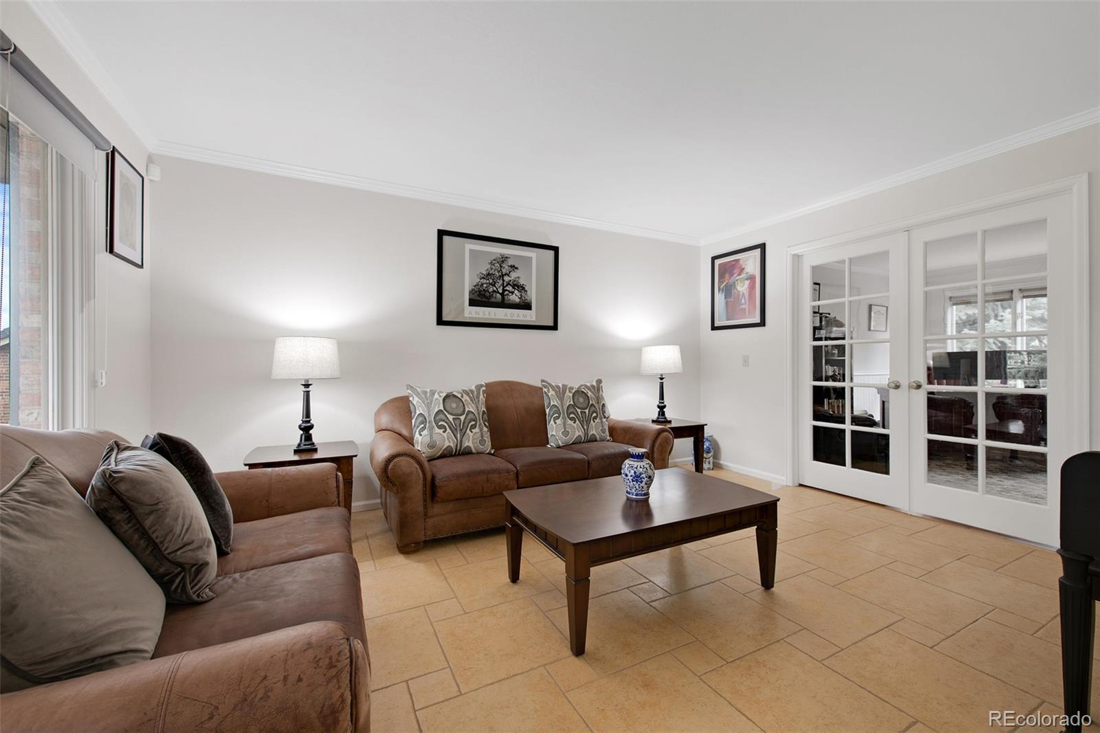 4 Mule Deer Trail Littleton, CO 80127 - Photo 18 of 40 a living room with furniture and a wooden floor