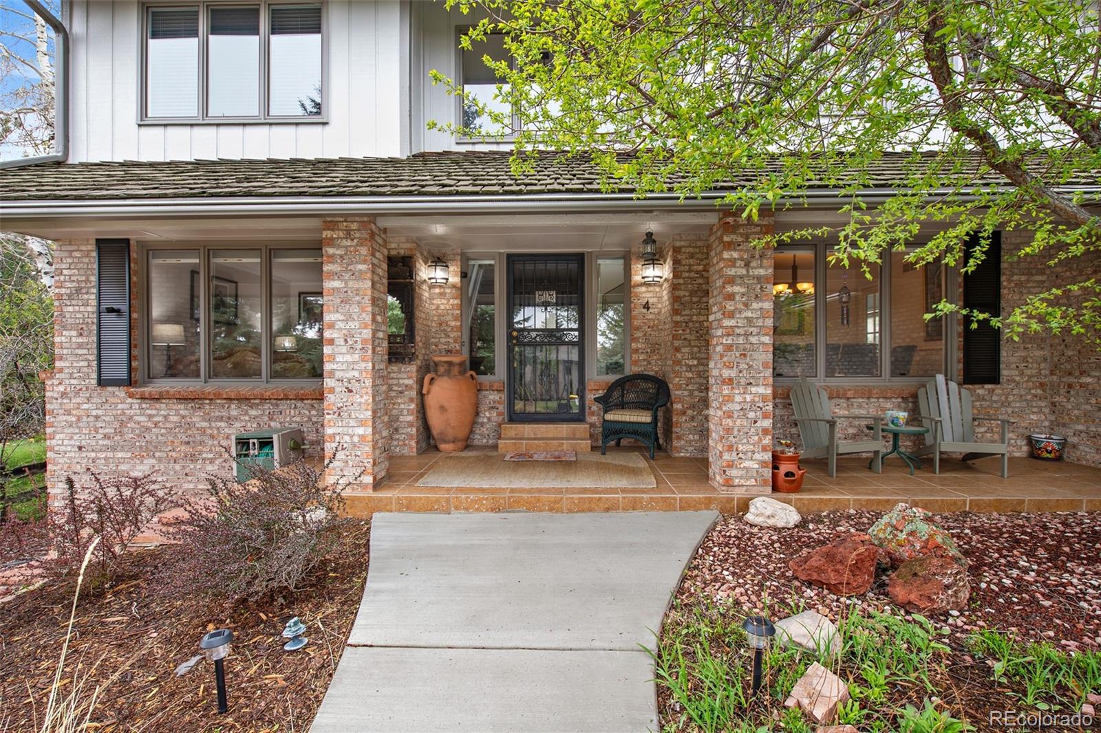 4 Mule Deer Trail Littleton, CO 80127 - Photo 2 of 40 a view of a house with a outdoor space