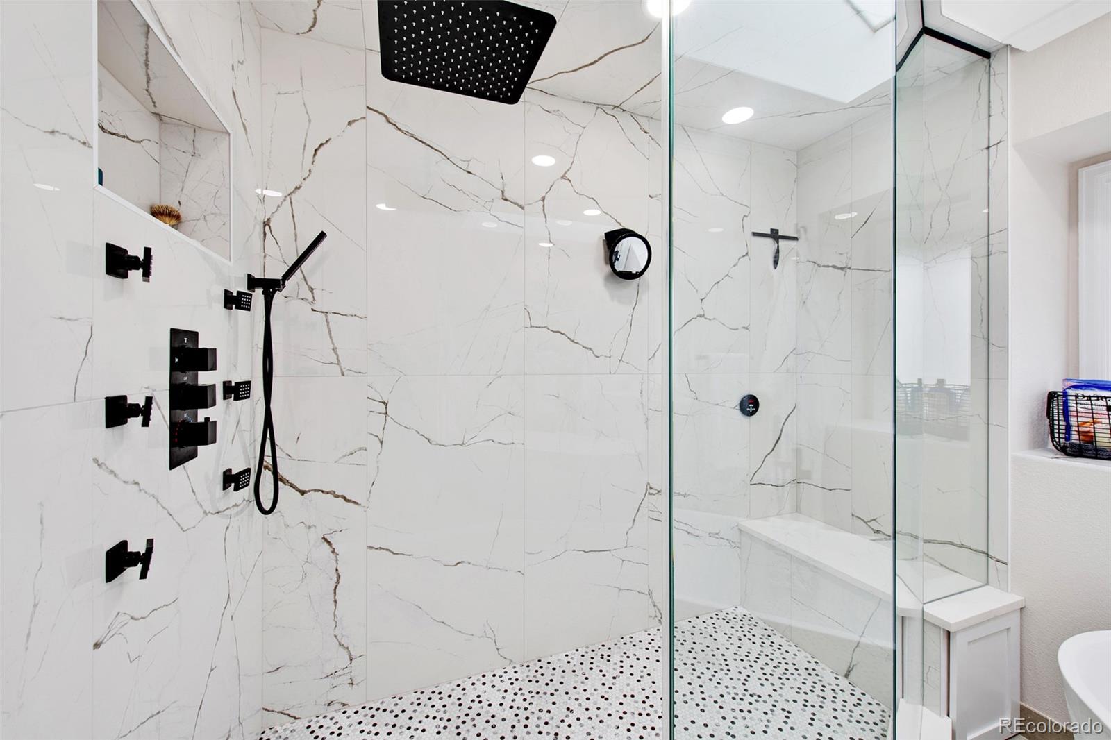 4 Mule Deer Trail Littleton, CO 80127 - Photo 24 of 40 a bathroom with a shower