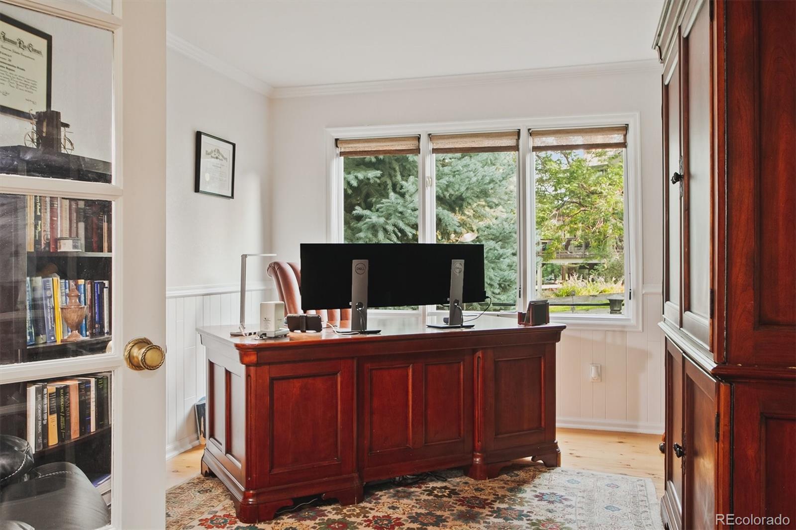 4 Mule Deer Trail Littleton, CO 80127 - Photo 27 of 40 a view of a workspace with furniture and a window