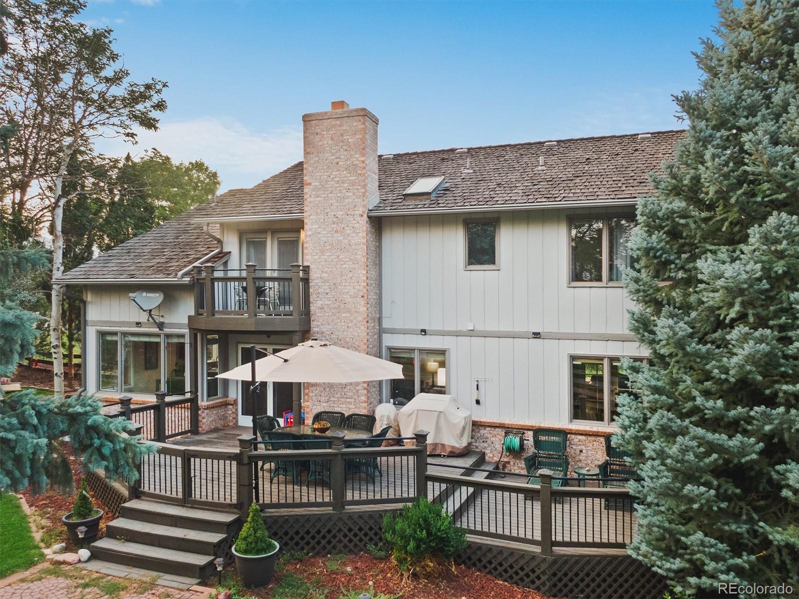 4 Mule Deer Trail Littleton, CO 80127 - Photo 33 of 40 a front view of a house with balcony