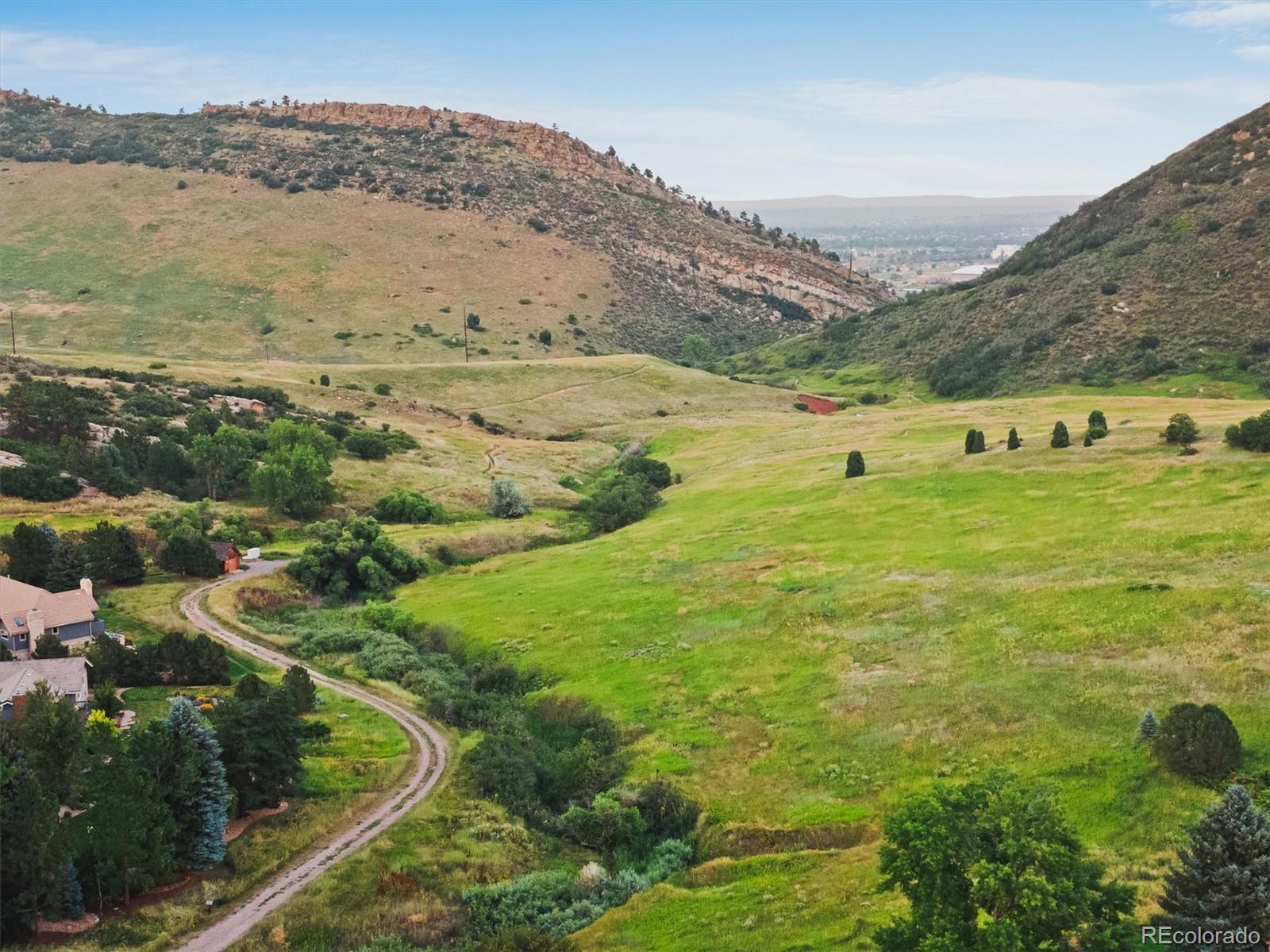 4 Mule Deer Trail Littleton, CO 80127 - Photo 39 of 40 a view of an outdoor space and mountain view