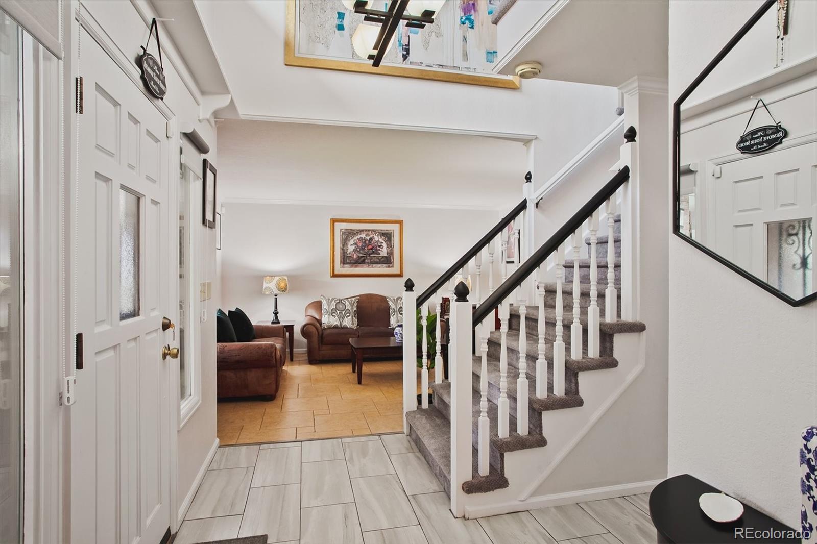 4 Mule Deer Trail Littleton, CO 80127 - Photo 4 of 40 a view of livingroom with furniture and stairs
