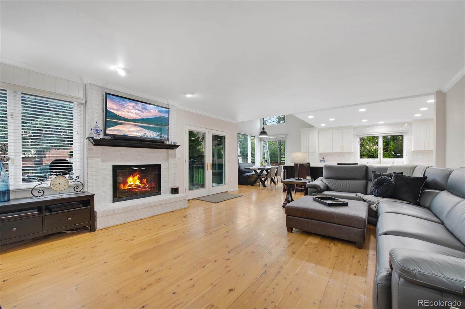 4 Mule Deer Trail Littleton, CO 80127 - Photo 8 of 40 a living room with furniture and a fireplace