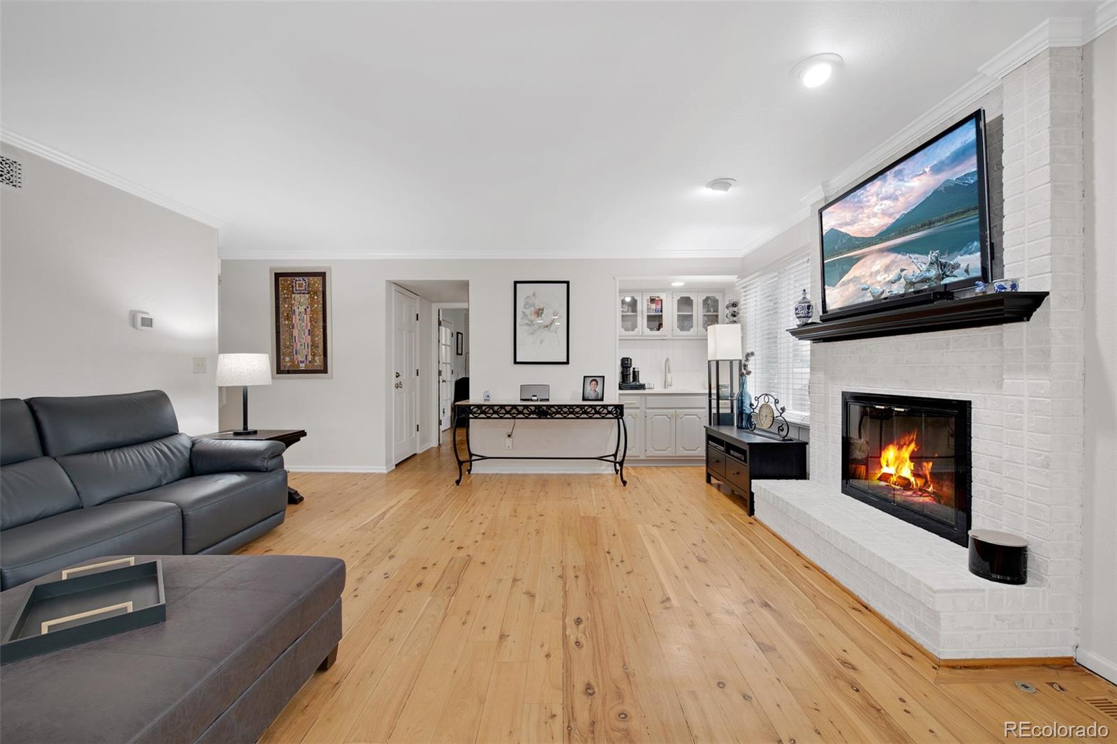 4 Mule Deer Trail Littleton, CO 80127 - Photo 9 of 40 a living room with furniture and a fireplace