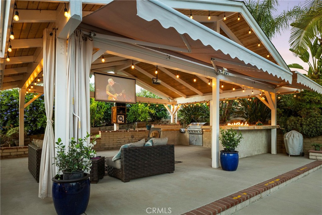 1446 Los Conejos Road Fallbrook, CA 92028 - Photo 39 of 66 a view of a patio with table and chairs potted plants