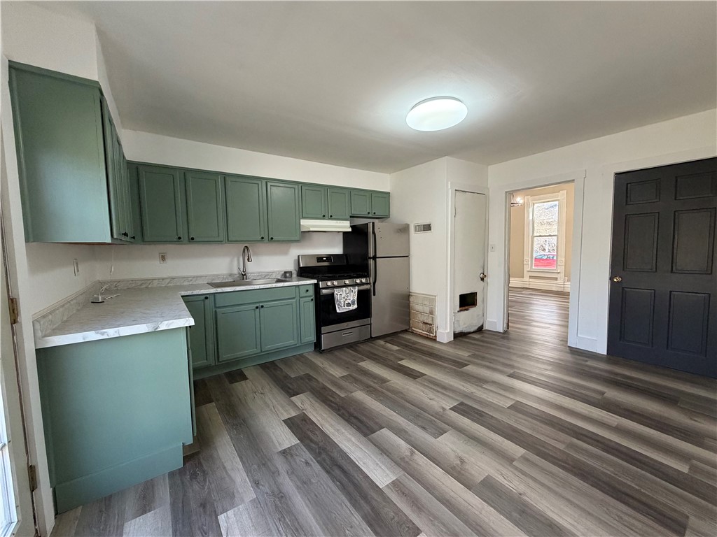 230 West Decatur Street Eaton, OH 45320 - Photo 6 of 22 This spacious kitchen offers a functional layout, perfect for daily living and culinary pursuits.